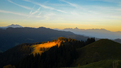 Scenic view of mountains against sky during sunset