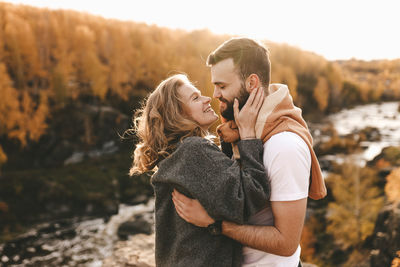 Midsection of couple standing outdoors