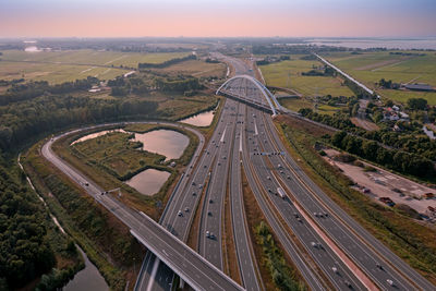 Aerial from junction muiderberg with the a1 in the netherlands at sunset