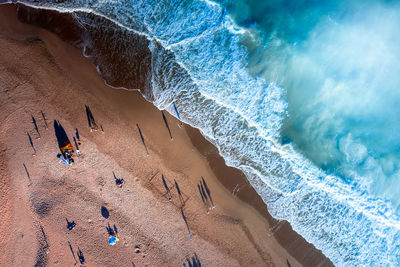 High angle view of surf on beach