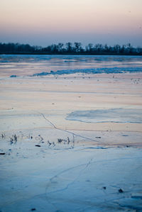 Scenic view of landscape against sky during winter