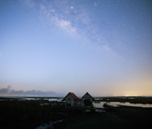 Buildings against sky at night