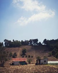 House and trees against sky