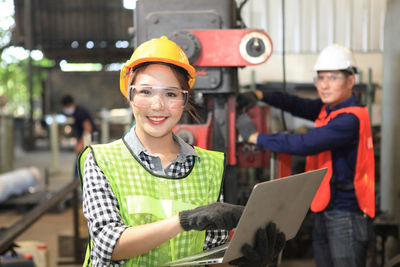 Portrait of smiling woman standing