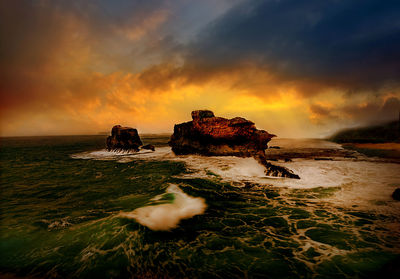 Scenic view of sea against sky during sunset