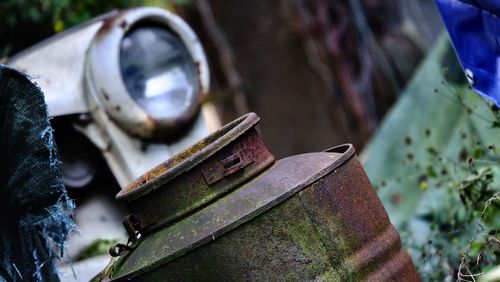 Front light of a famous rotten trabant car on at a scrap yard