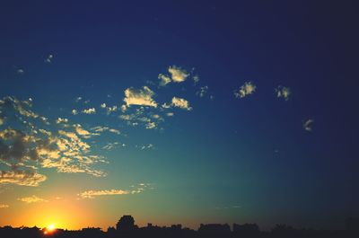 Silhouette of trees against sky at sunset