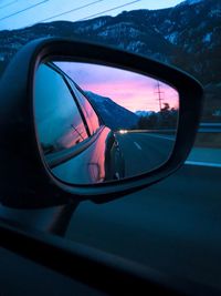 Reflection of car on side-view mirror