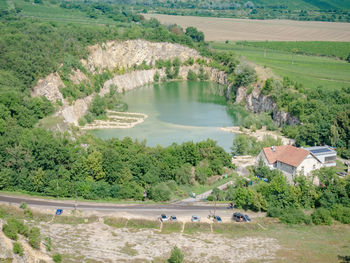 Blue green water of flooded janicuv mine lake. the swamped janicuv vrch quarry in palava region