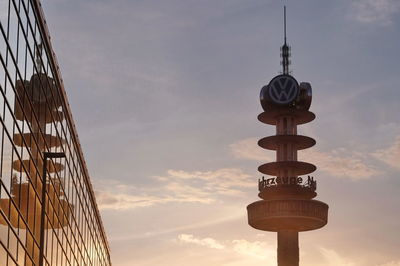 Low angle view of communications tower against sky