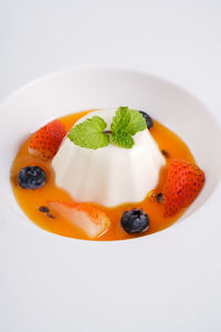 Close-up of food in plate on white background