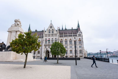 People in front of historic building