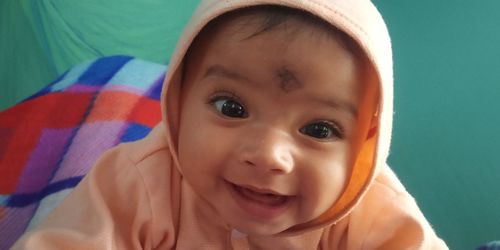 Close-up portrait of cute baby girl