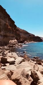 Scenic view of sea against clear blue sky