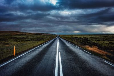 Road amidst landscape against sky