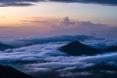 Scenic view of mountain peaks during sunset