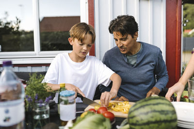 Father and son on table