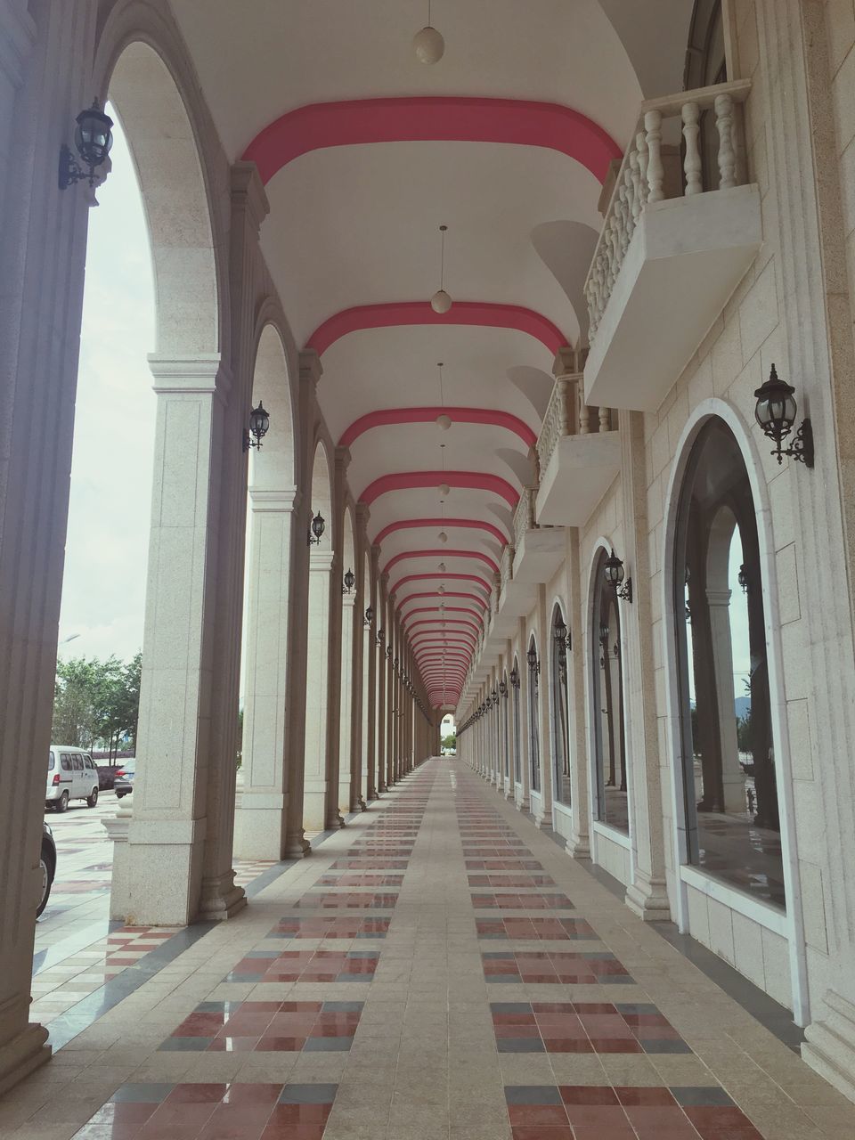 architecture, built structure, the way forward, arch, diminishing perspective, architectural column, in a row, vanishing point, column, day, city, walkway, building, outdoors, no people, empty, long, narrow, travel destinations