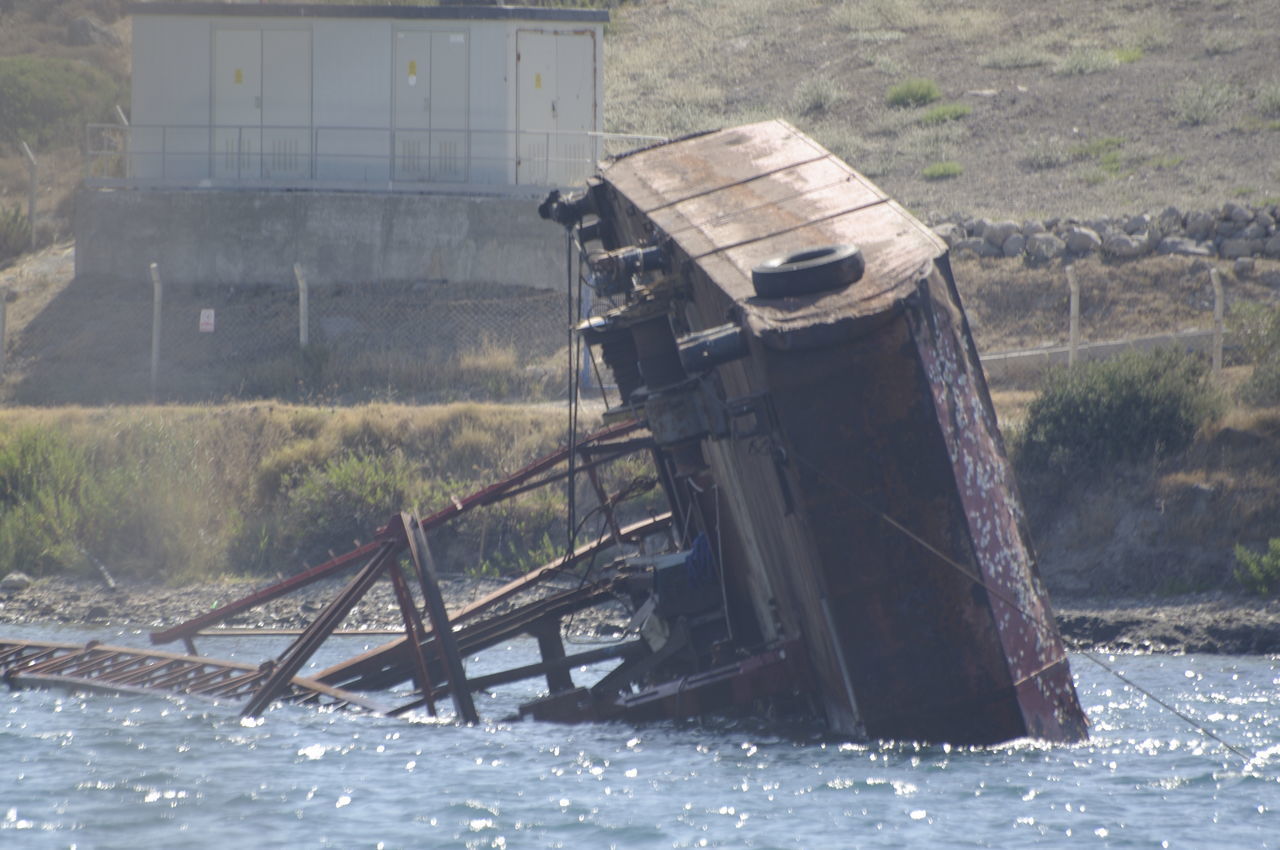 ABANDONED BOAT ON LAND