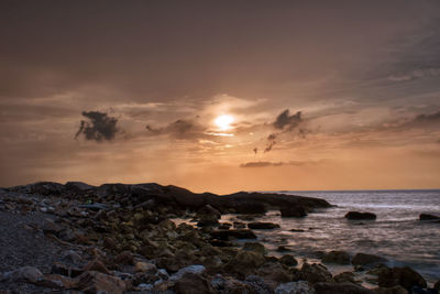 Scenic view of sea against sky during sunset