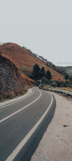 Empty road against clear sky