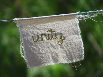 Close-up of clothespins hanging on clothesline