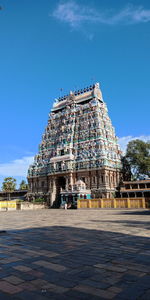 View of temple building against blue sky