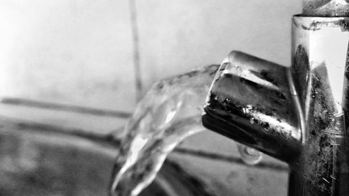 Close-up of water drop on metal