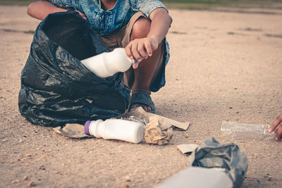 Low section of man sitting on field