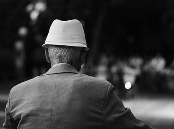 Rear view of man in the dark