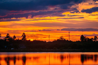 Scenic view of lake against romantic sky at sunset