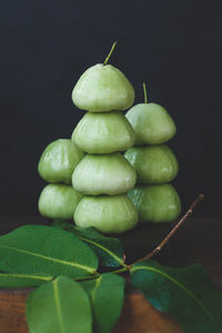 Close-up of fruits against black background