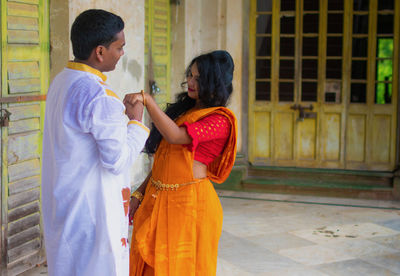 Side view of indian couple of standing at outdoor.