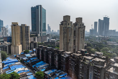 Modern buildings in city against sky