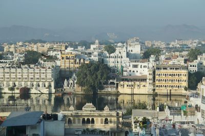 High angle view of buildings in city against sky