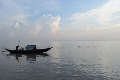 Boat in sea against sky