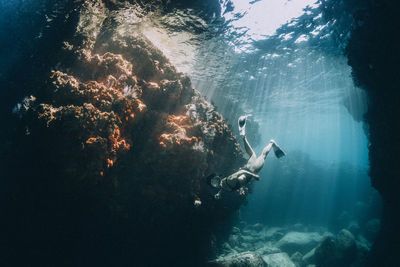 Full length of woman swimming underwater