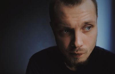 Close-up of young man looking away