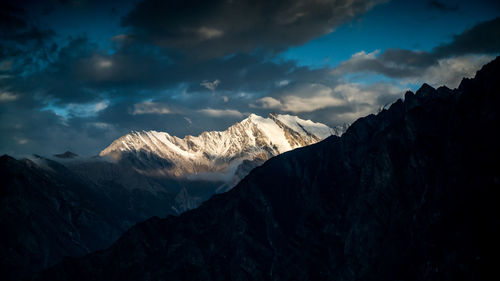 Scenic view of snowcapped mountains against sky