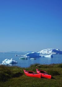 Scenic view of sea against clear blue sky