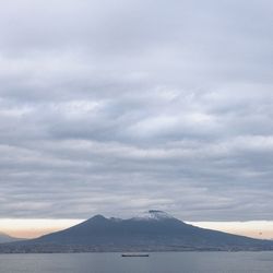 Scenic view of lake against sky during winter