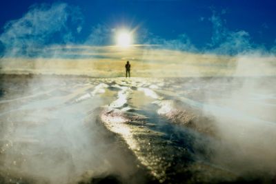 Person standing on snow covered land