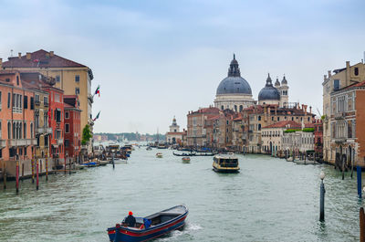 Grand canal in venice, italy, with devin santa maria della salute church domintaing in the cityscape
