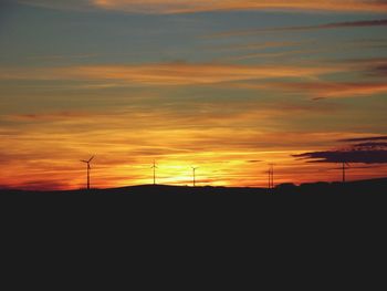 Scenic view of silhouette landscape at sunset