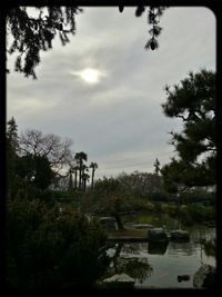 Scenic view of lake against cloudy sky