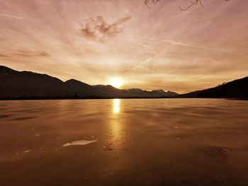 Scenic view of sunset over lake