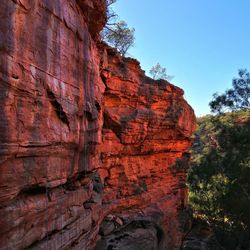 Low angle view of rock formation against sky