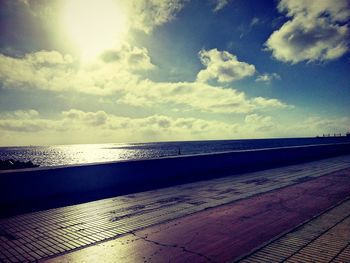 Scenic view of sea against cloudy sky