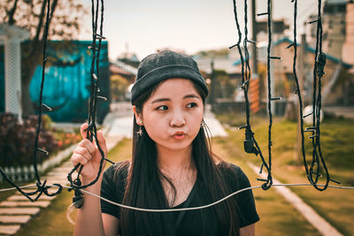 Portrait of beautiful woman standing outdoors