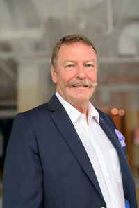 Portrait of senior man wearing suit